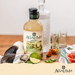 Agalima Margarita Mix bottle beside tequila for effortless at-home cocktail creation.