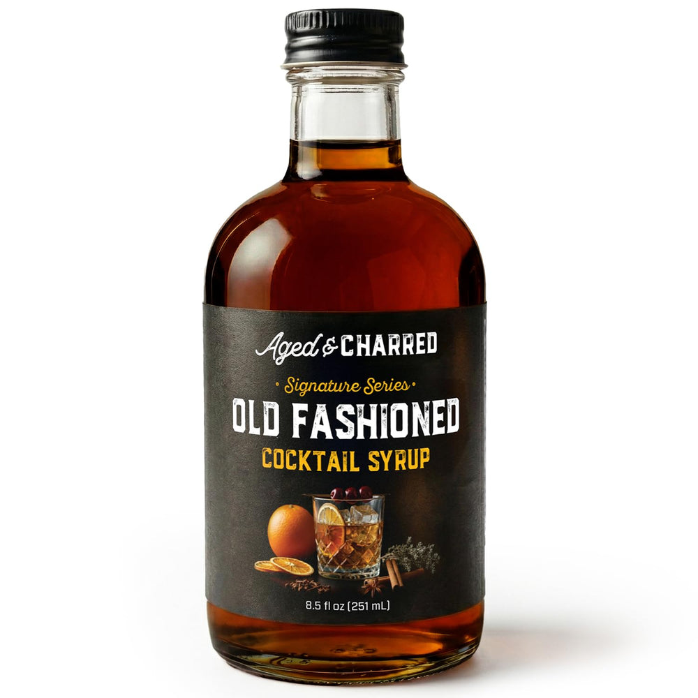 Aged and Charred Old Fashioned Mix bottle pour for a bar-quality home cocktail.