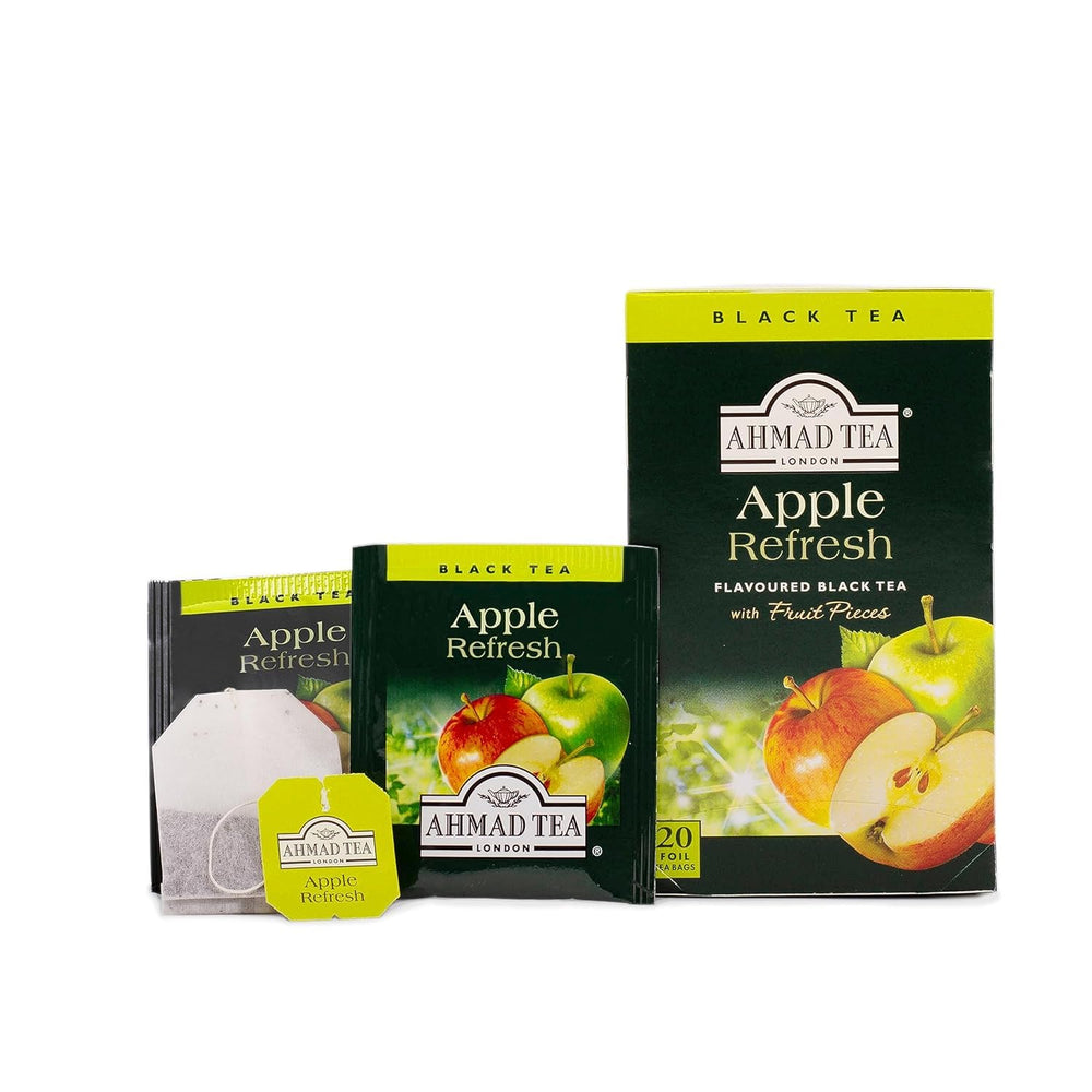 Close-up of Ahmad Tea Apple Refresh teabags with real apple pieces.