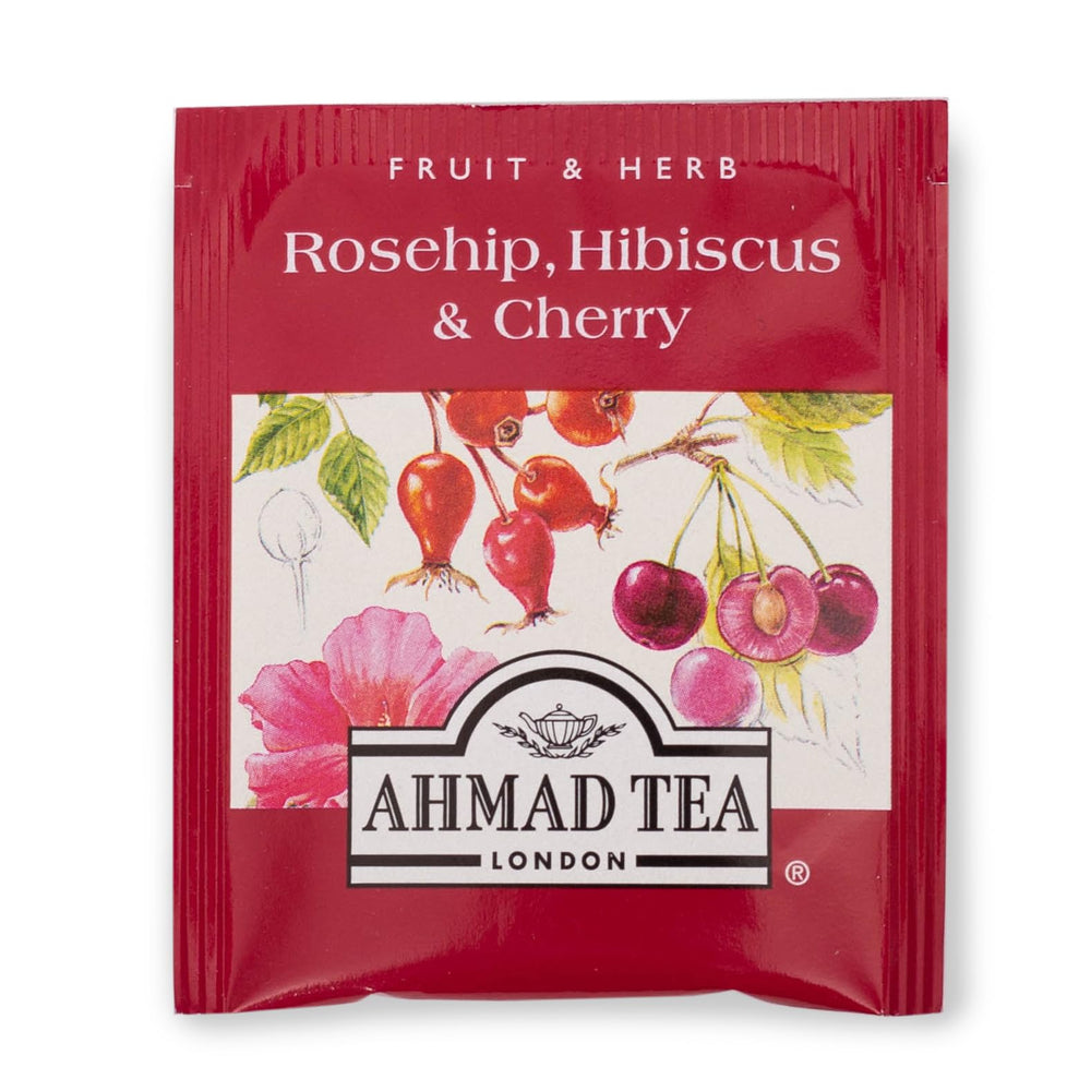 Ahmad Tea botanicals close-up with dried fruit and flowers, inviting aroma.