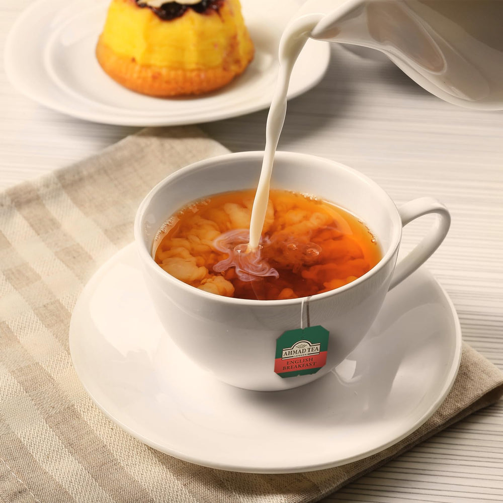 Ahmad Tea English Breakfast box and cup suggesting a perfect breakfast pairing.
