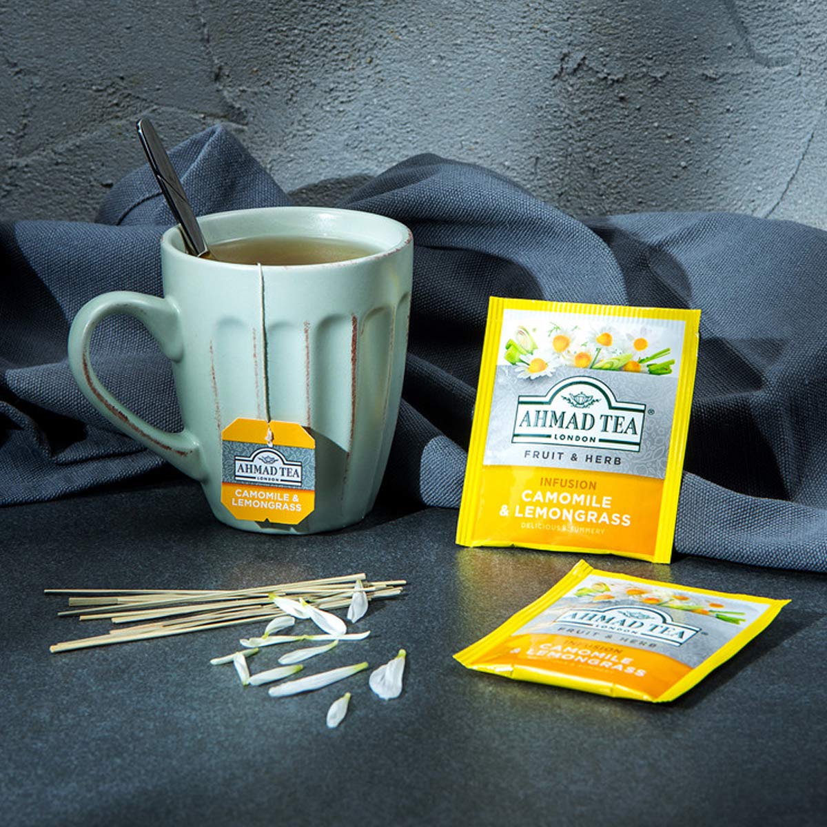 Hot or iced Ahmad Tea brew in a warm amber cup.