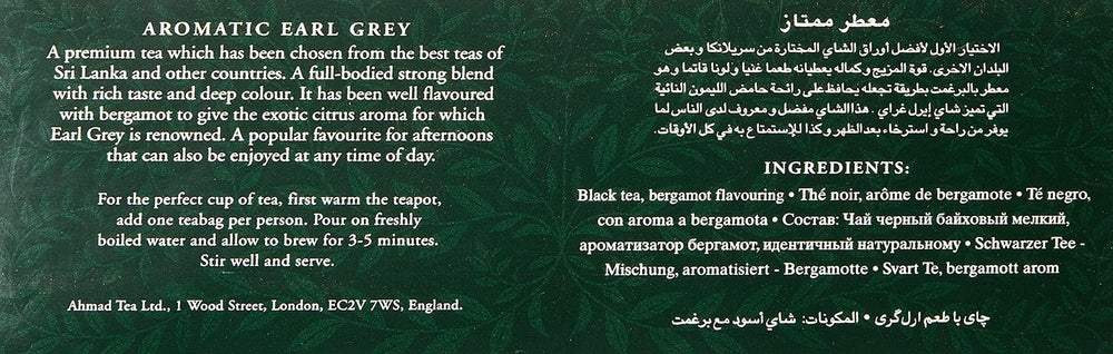 Ahmad Tea steeping tea bag releases citrusy bergamot notes during infusion.