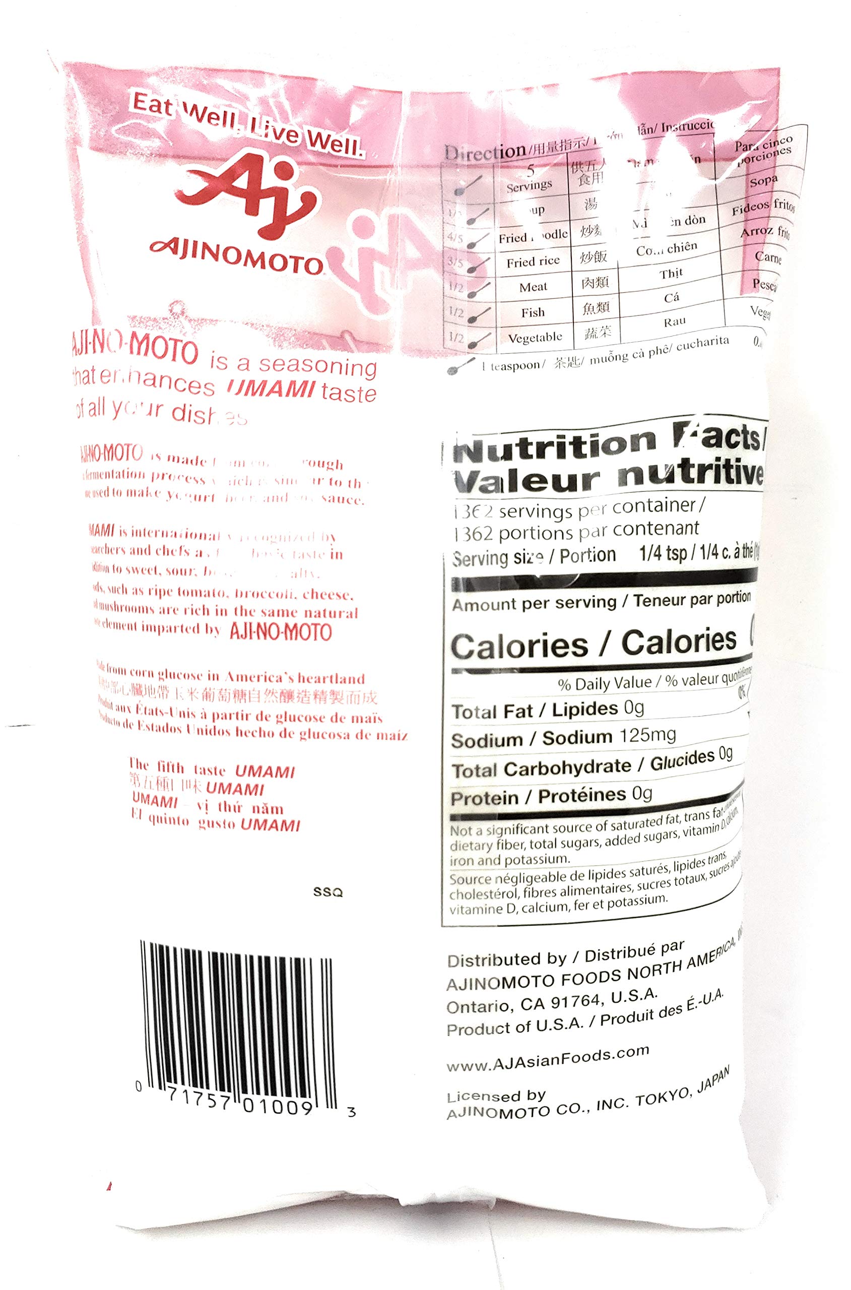 Ajinomoto umami seasoning scoop beside jar for easy flavor boosting.