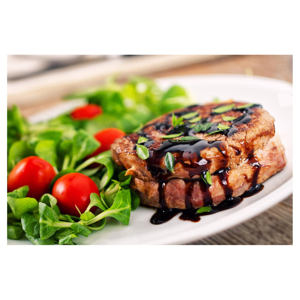 Drizzle Alessi Autentico balsamic reduction on salads for finishing brightness.