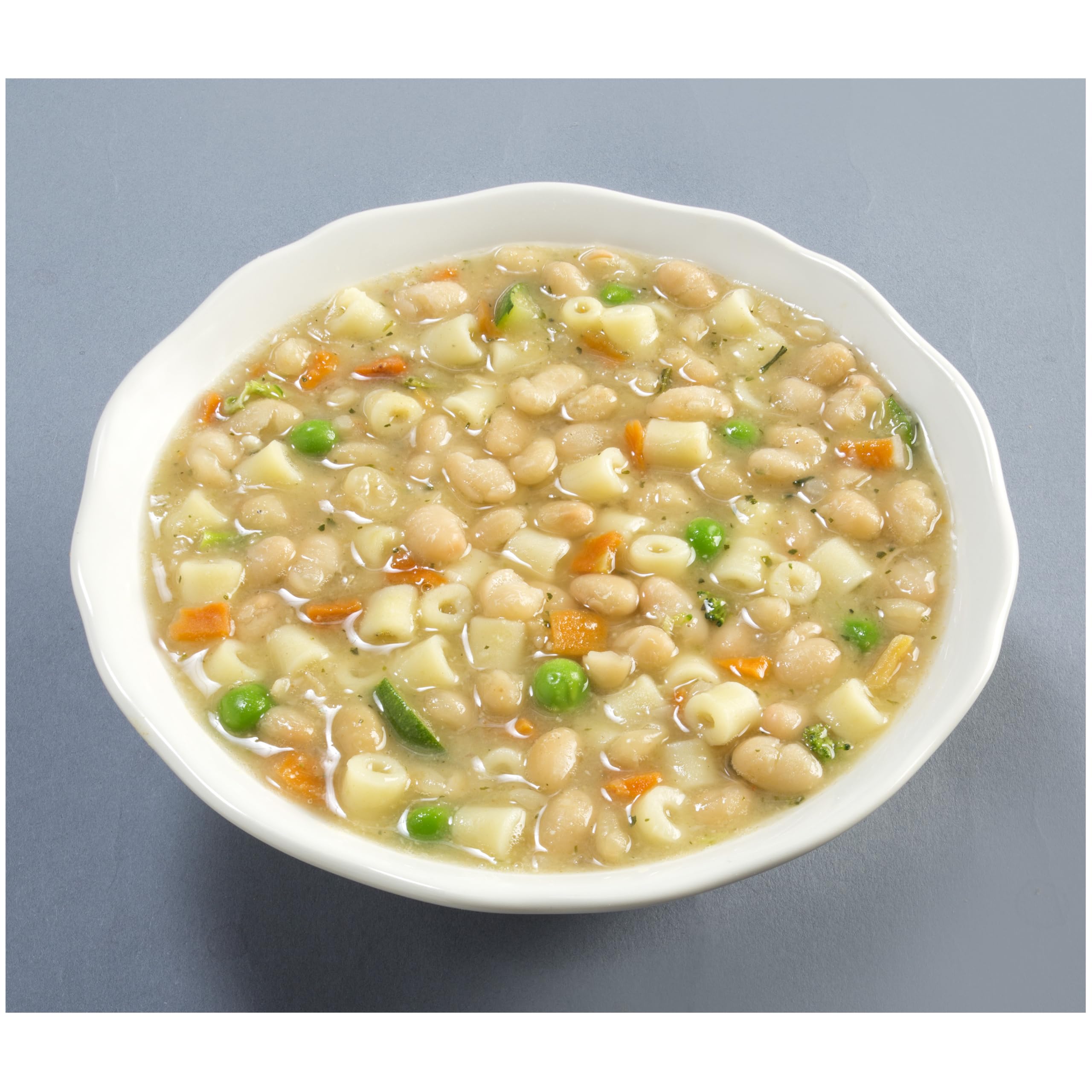 Creamy Tuscan White Bean soup in a bowl invites a cozy lunch.