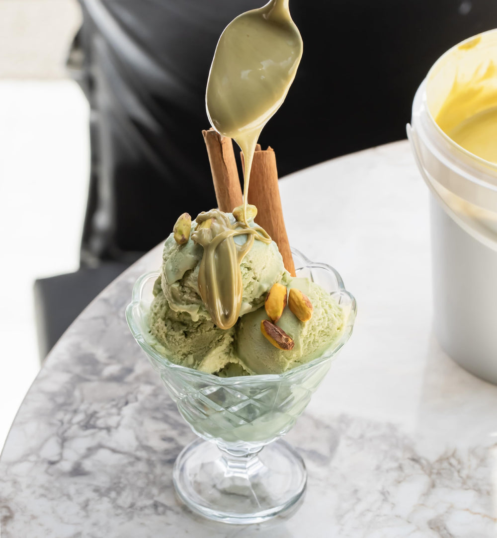 Label close-up on Alkis Pistachio Cream airtight bucket.