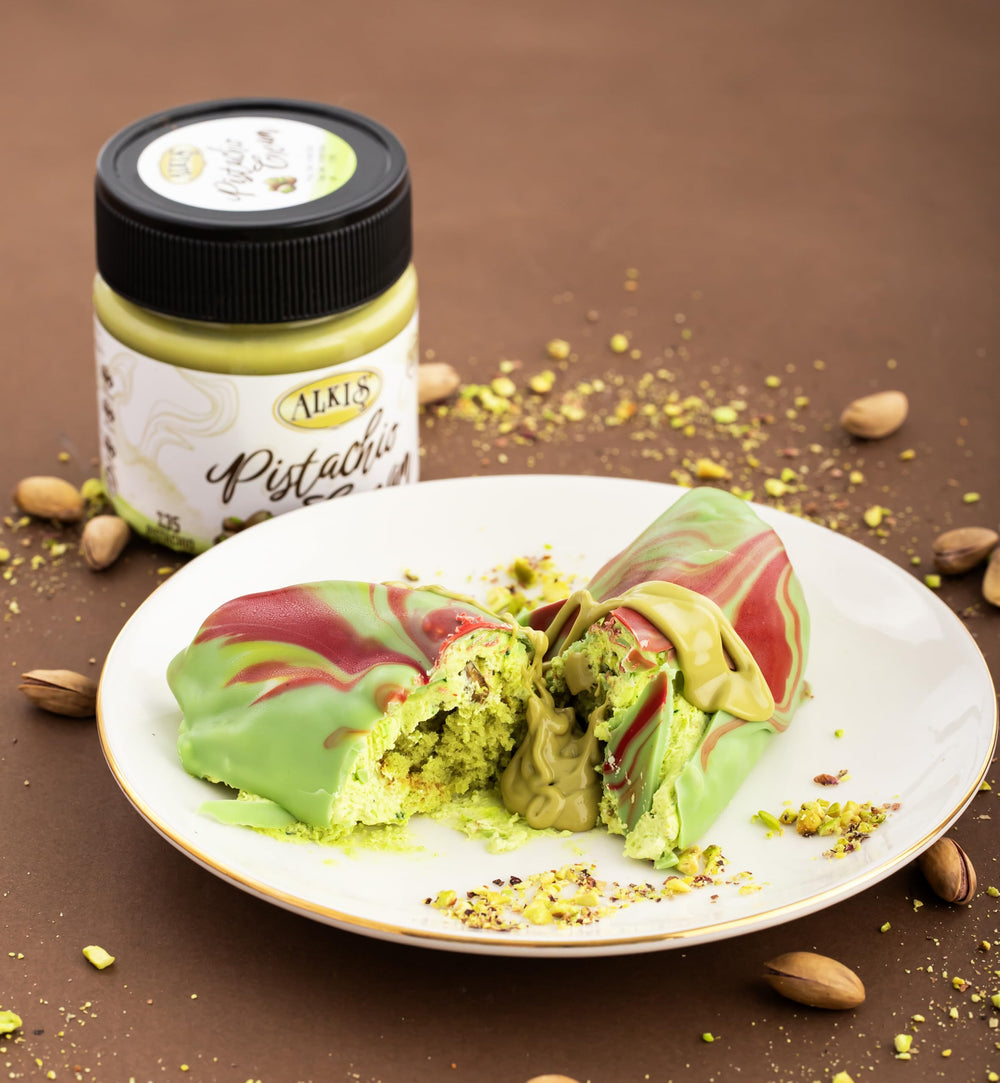 Alkis Pistachio Cream jar on kitchen counter suggesting gift-ready packaging.
