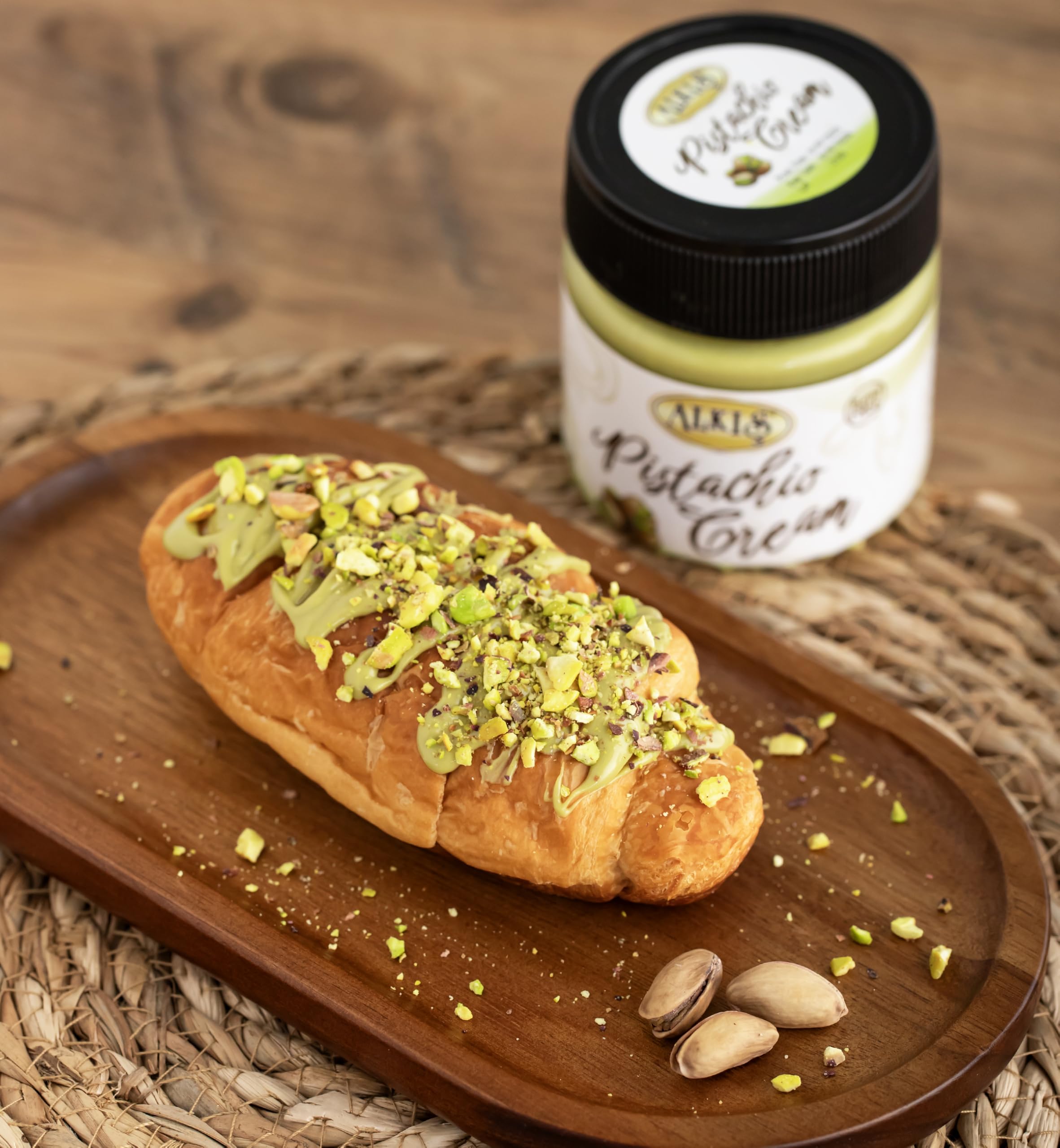 Alkis Pistachio Cream on toasted bread illustrating quick breakfast option.