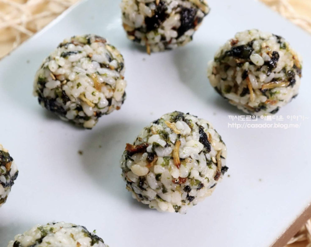 All About Living seaweed beside a bowl of rice for texture.