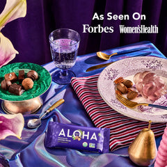 ALOHA Chocolate Caramel Pecan bar on the kitchen counter, gluten-free and non-GMO snack.