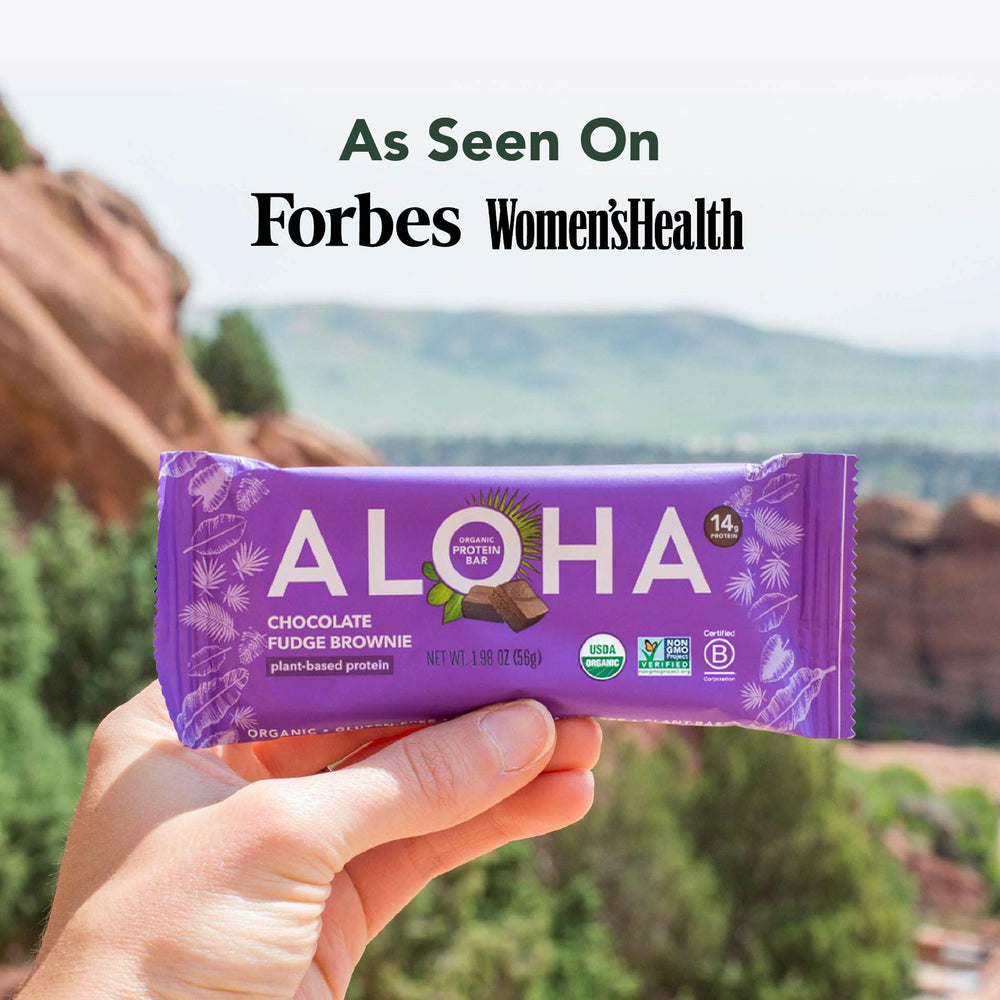 ALOHA protein bar at a desk for post-workout or mid-day energy.