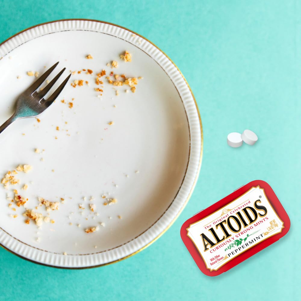 ALTOIDS Peppermint tin on desk suggests quick refresh before meetings.