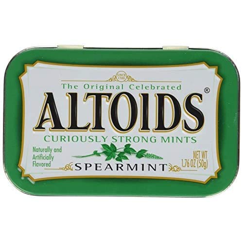 Pocket-size Altoids tin in hand, ideal for on-demand breath confidence.