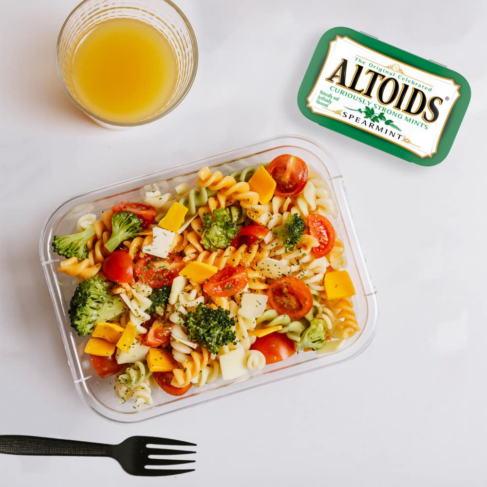 Altoids Spearmint mints breath-freshness closeup suggests long-lasting confidence.