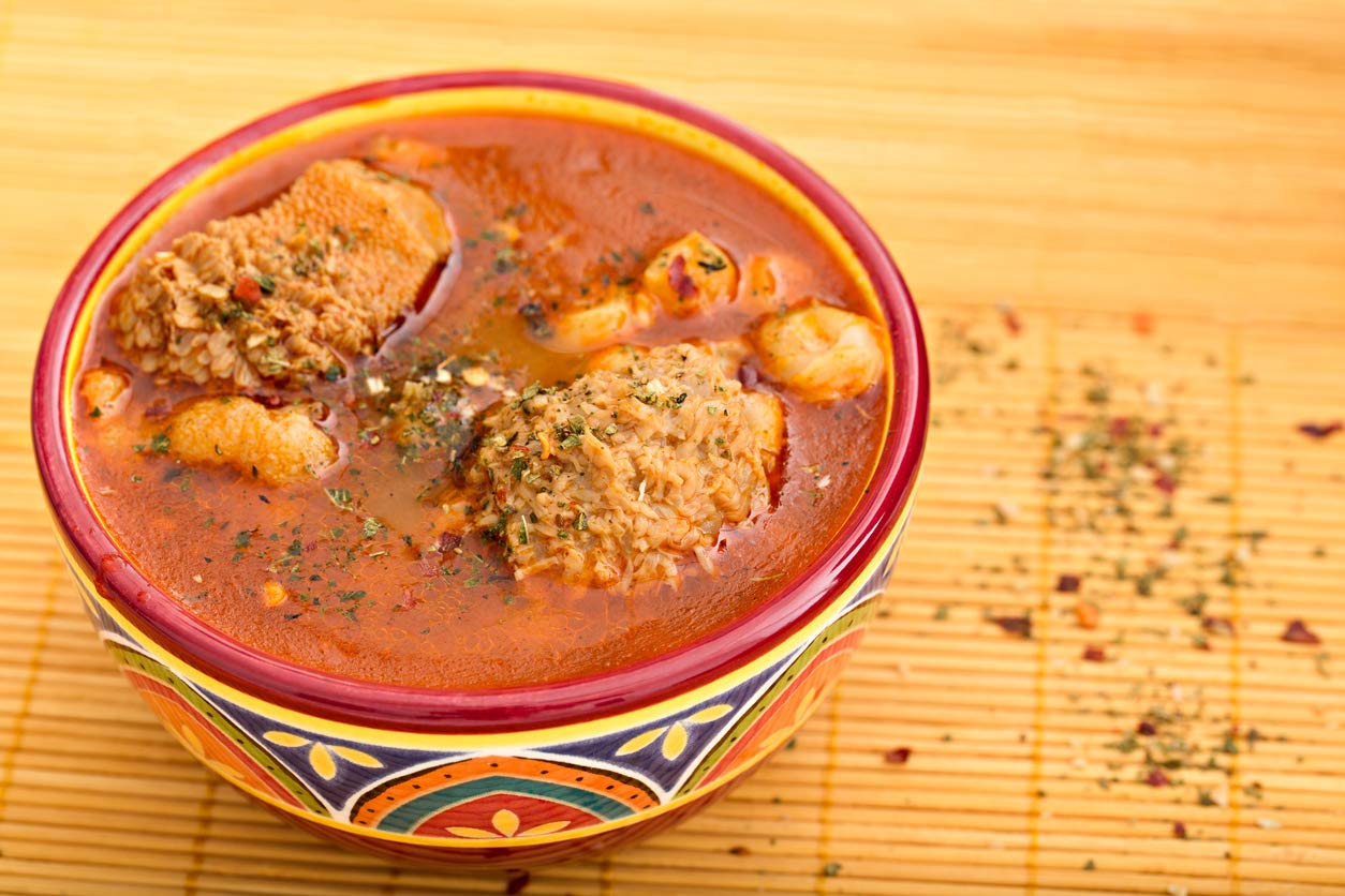Amazing Chiles & Spices spice blend poured over simmering stew for depth
