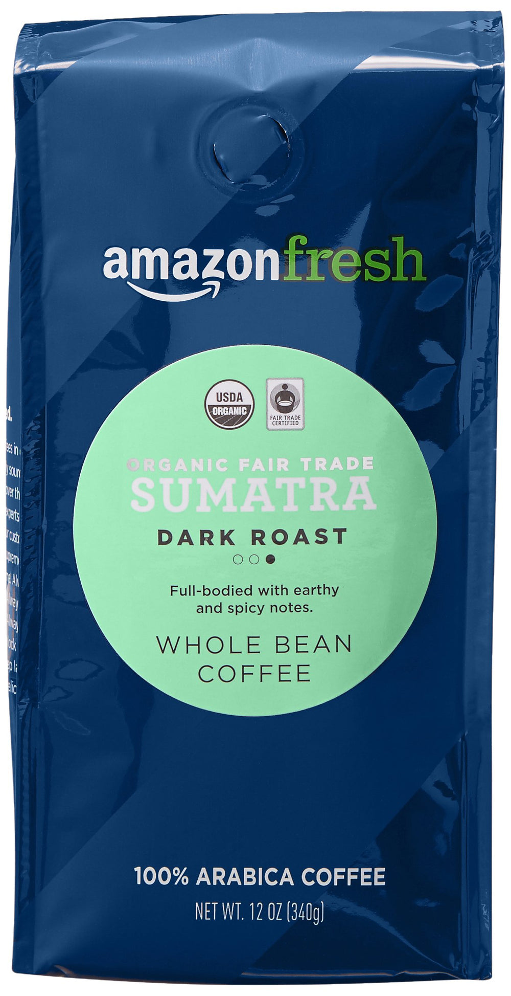 Amazon Fresh Sumatra whole bean coffee close-up with deep dark roast aroma.