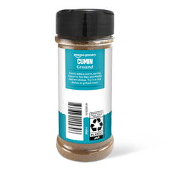 Amazon Grocery ground cumin being sprinkled over a finished dish for depth