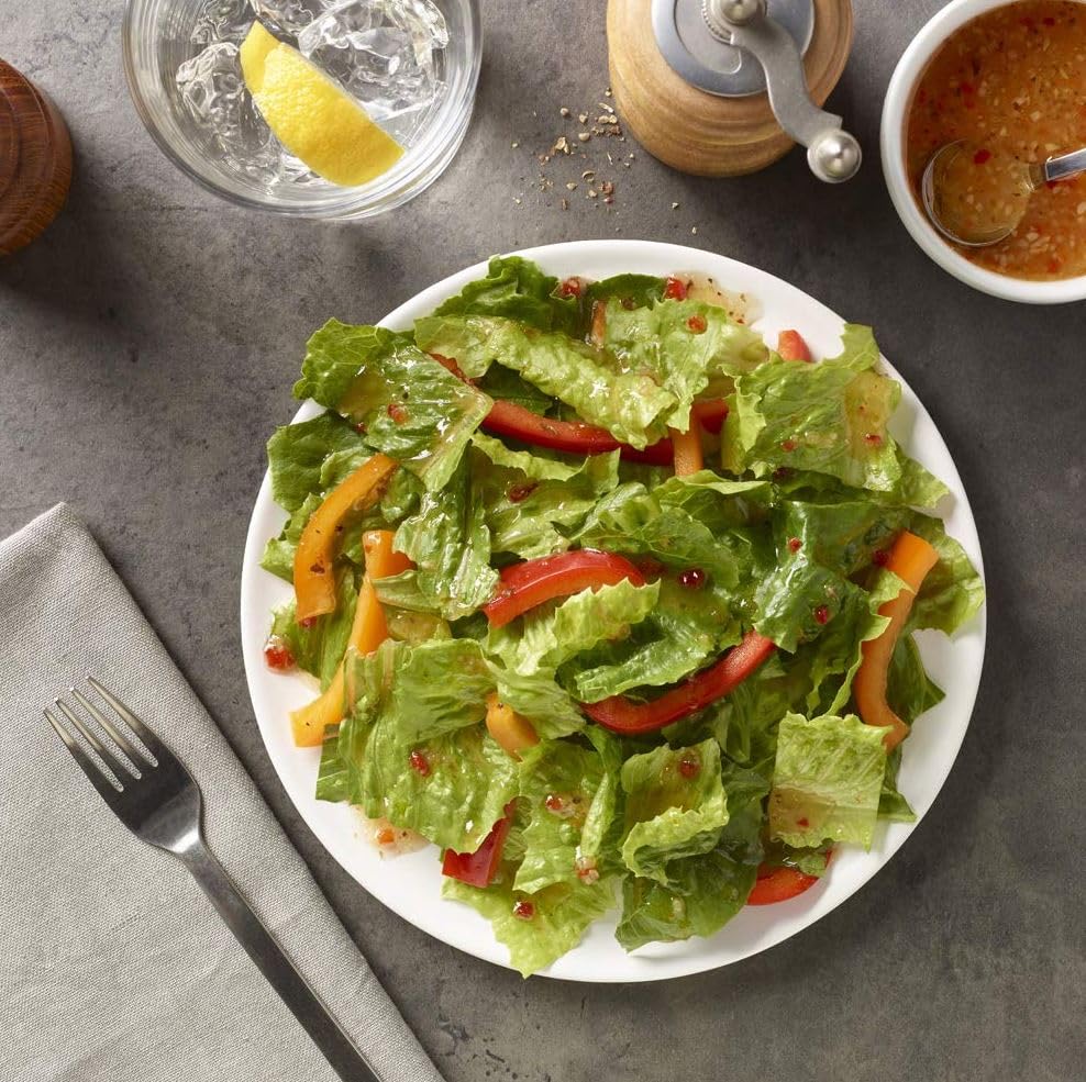 Amazon Saver Italian Dressing on a colorful salad plate with greens