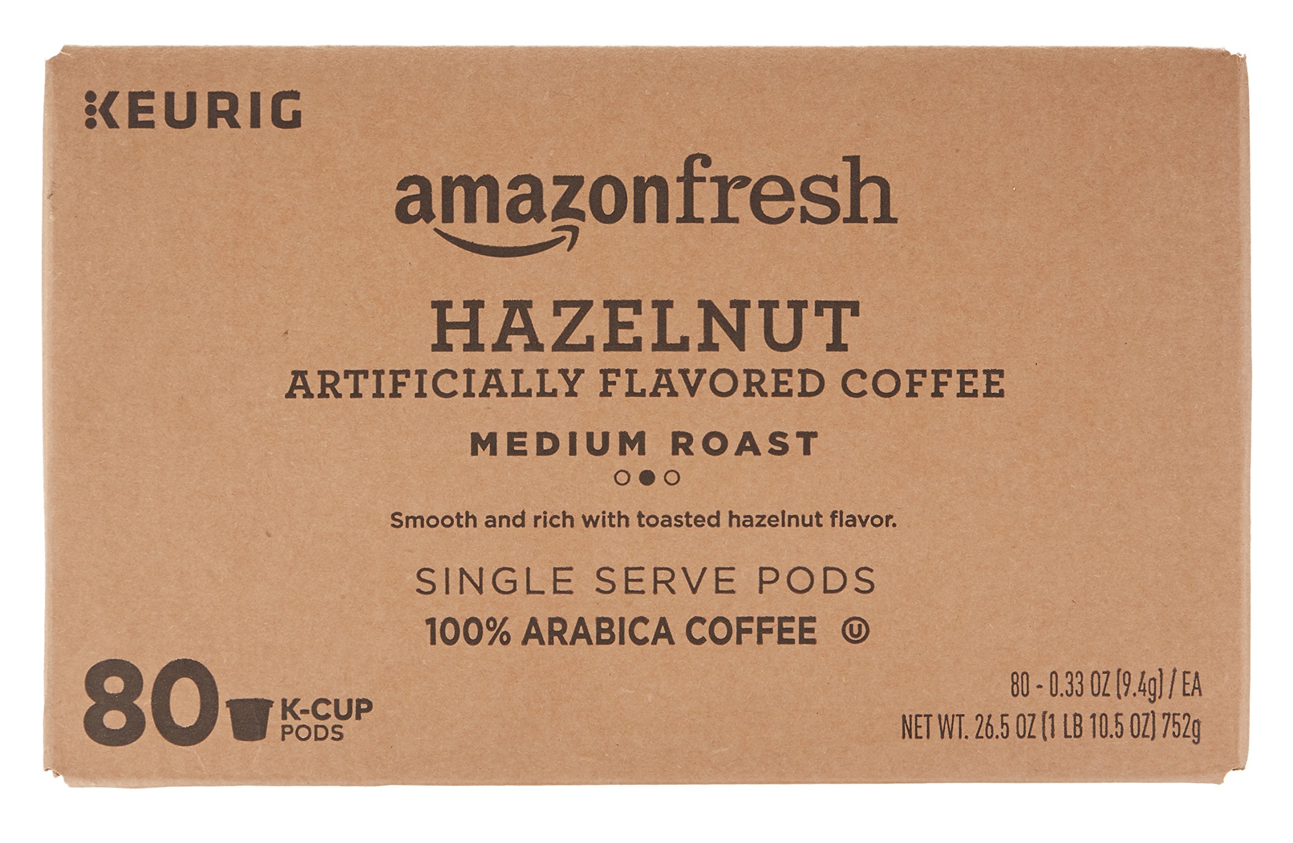 Keurig-compatible AmazonFresh hazelnut K-Cup shown during machine-ready brewing.
