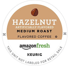 Close-up of AmazonFresh hazelnut K-Cup pod highlighting premium Arabica beans.