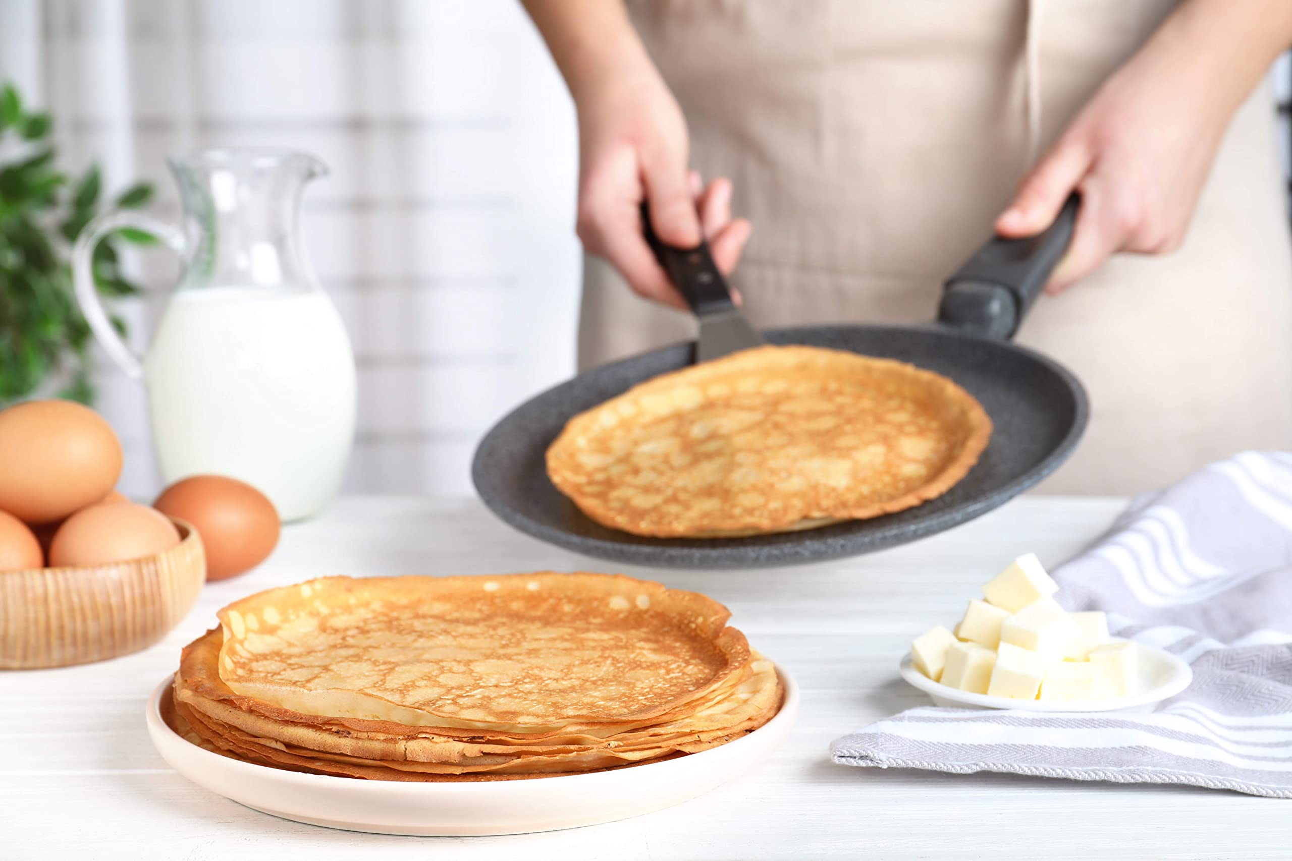 Crepes served with fresh fruit on a plate made with American Table mix.