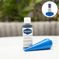 AmeriColor royal blue drops offer precise shading for consistent cake decorations.