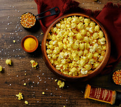 Amish Country Popcorn Ballpark ButterSalt on kitchen counter, ready to season bowls.
