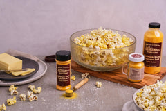 Amish Country Popcorn Ballpark ButterSalt being poured for quick popcorn seasoning.