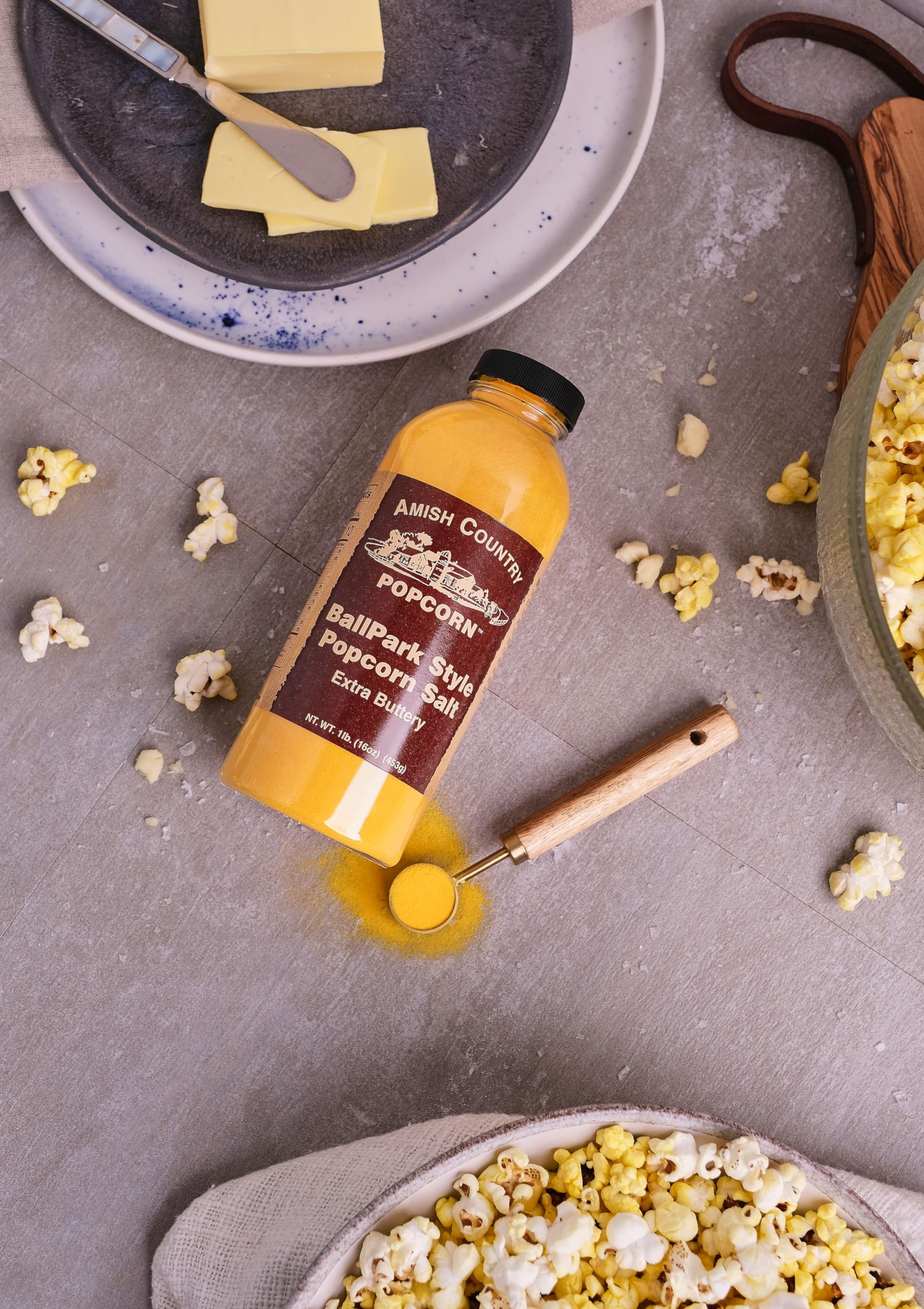 Serving spoon with ButterSalt over popcorn.