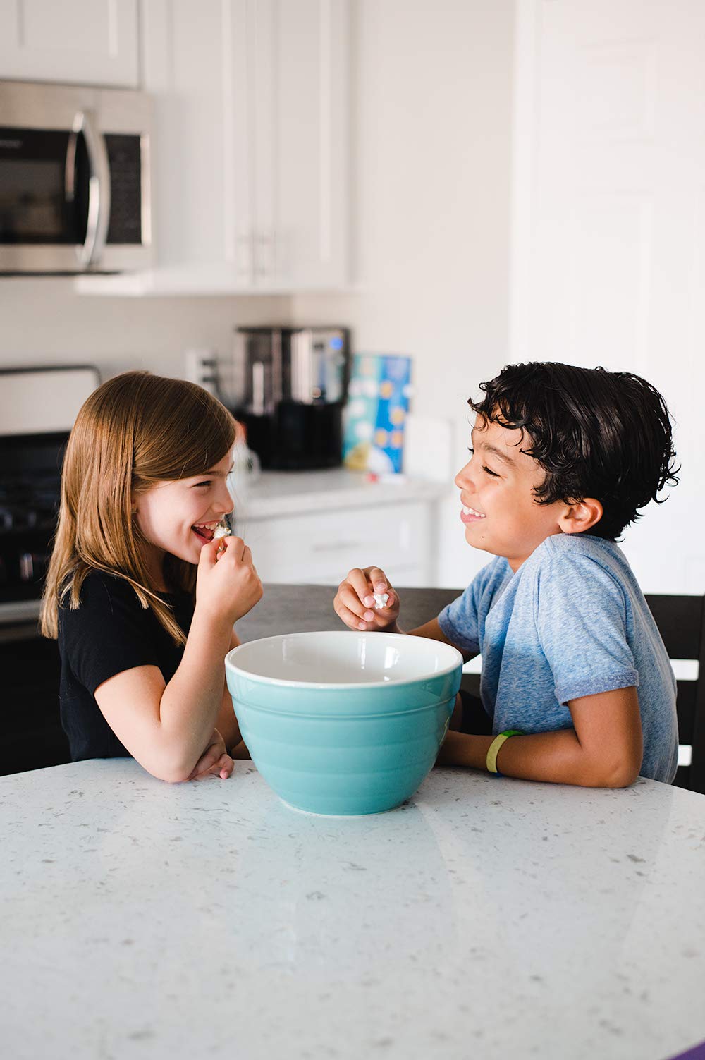 Amish Country Popcorn Buttery Topping bowl shot with popcorn and coating.