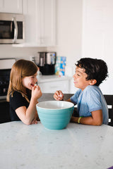 Amish Country Popcorn Buttery Topping bowl shot with popcorn and coating.