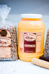 Amish Country Popcorn coconut oil bottle pour demonstrates easy, even coating for fluffy popcorn