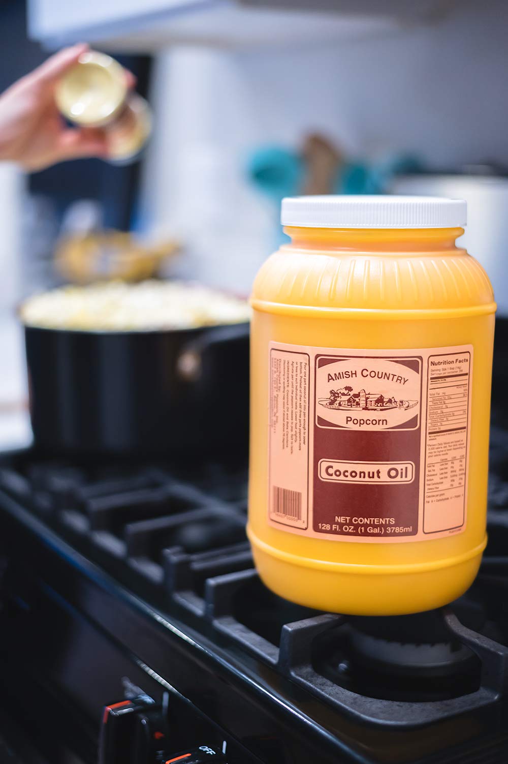 Amish Country Popcorn coconut oil non-GMO badge signals clean ingredients for mindful snacking