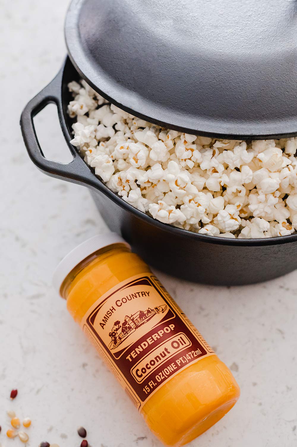 Amish Country Popcorn coconut oil pouring captures glossy, inviting drizzle.