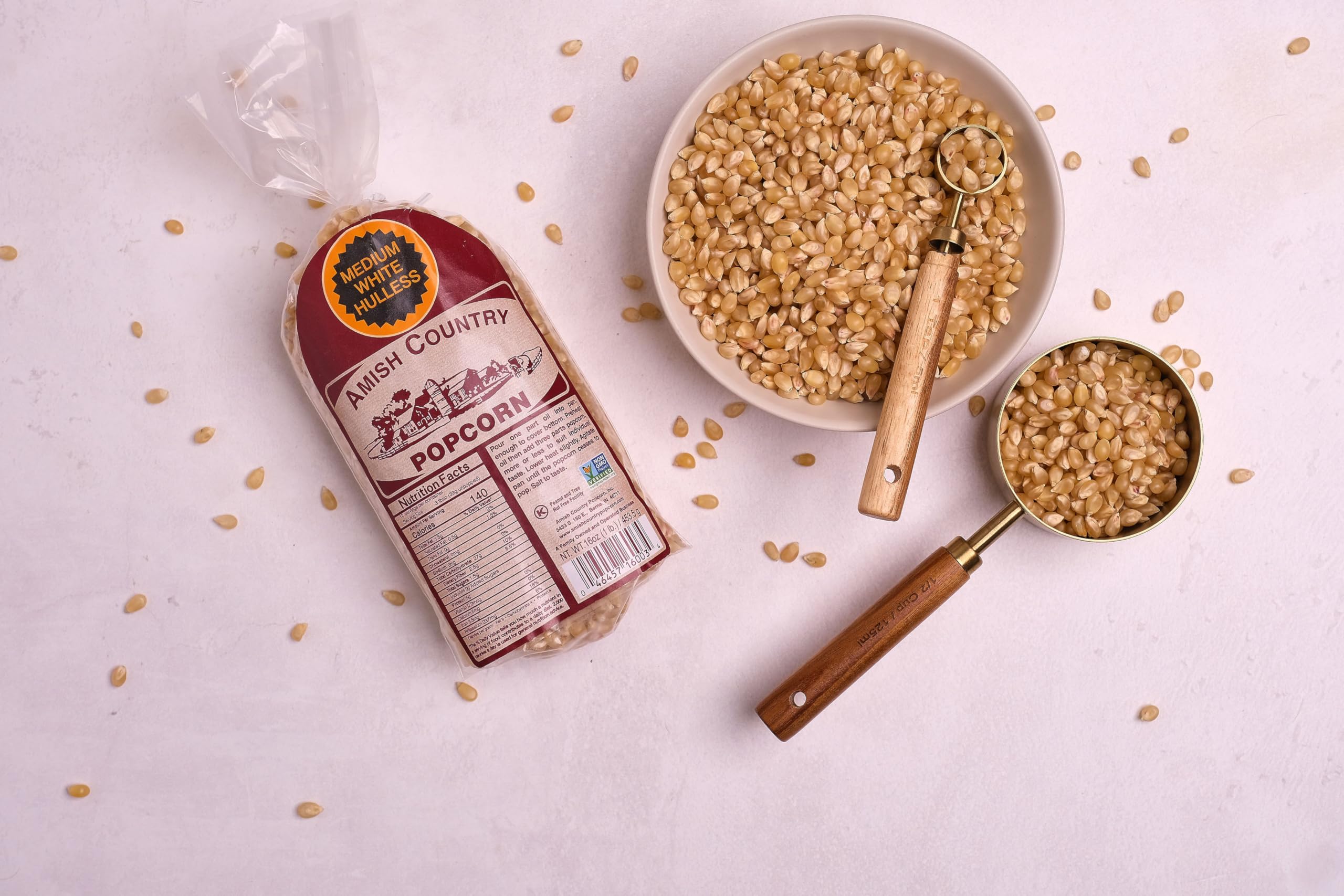 Amish Country Popcorn kernels being poured for easy portioning.