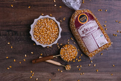 Amish Country Popcorn pouring into a bowl for a fresh snack.