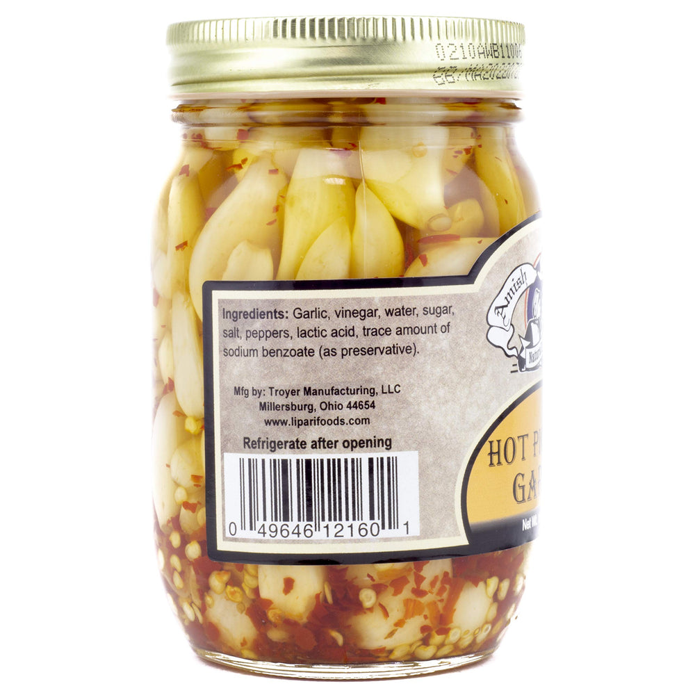 Amish Wedding hot-pickled garlic on a serving board for bold bites.