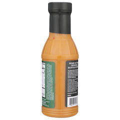 Sauce being poured over chicken for tangy glaze and moist texture