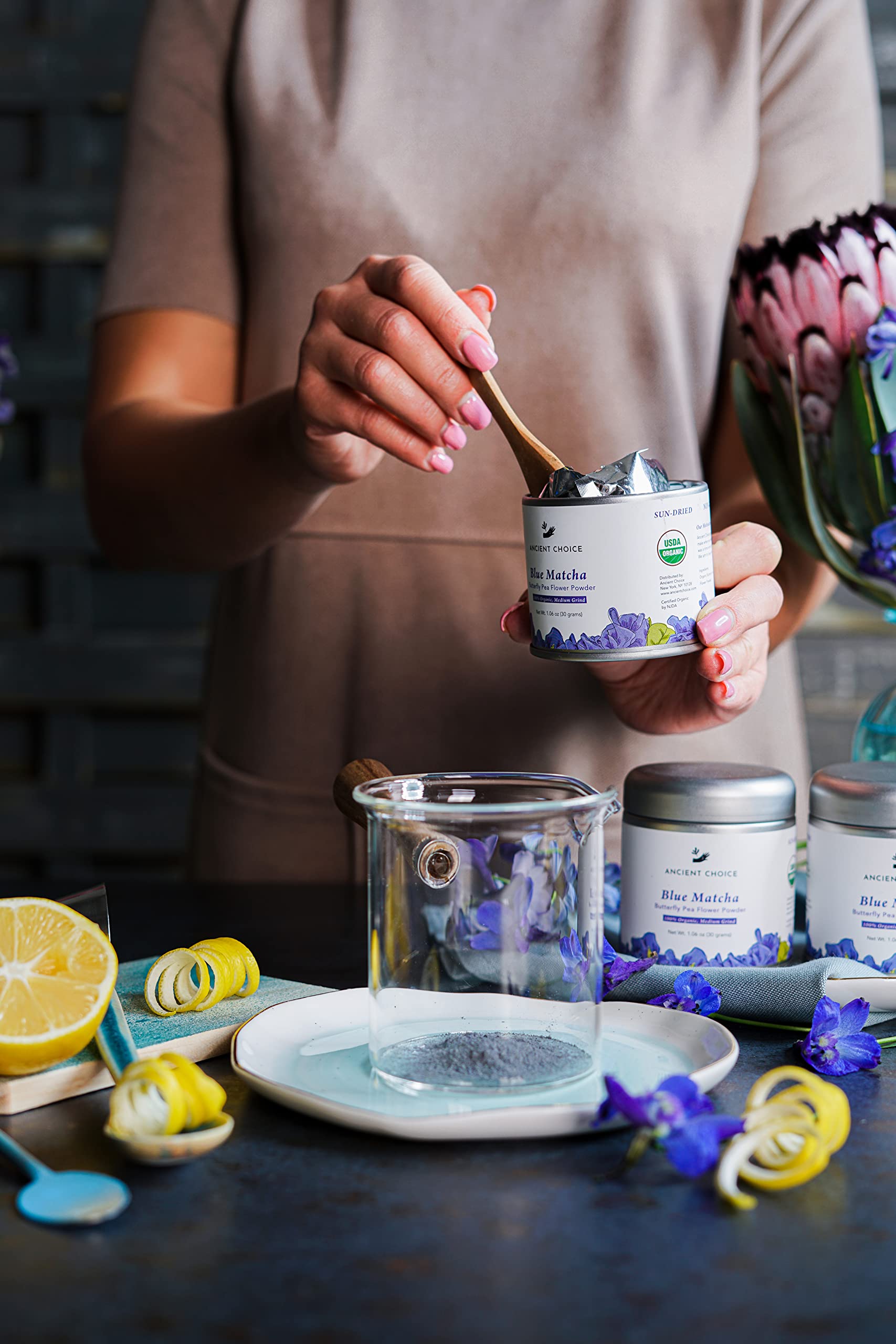 Ancient Choice blue matcha tin canister on shelf highlights sustainable, reusable packaging.