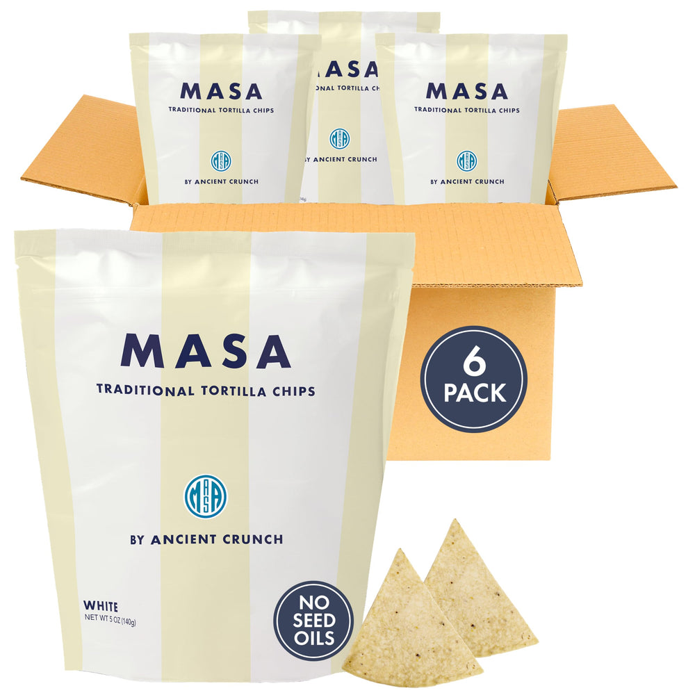 Ancient Crunch MASA white corn chips in bag, crisp and ready for salsa.