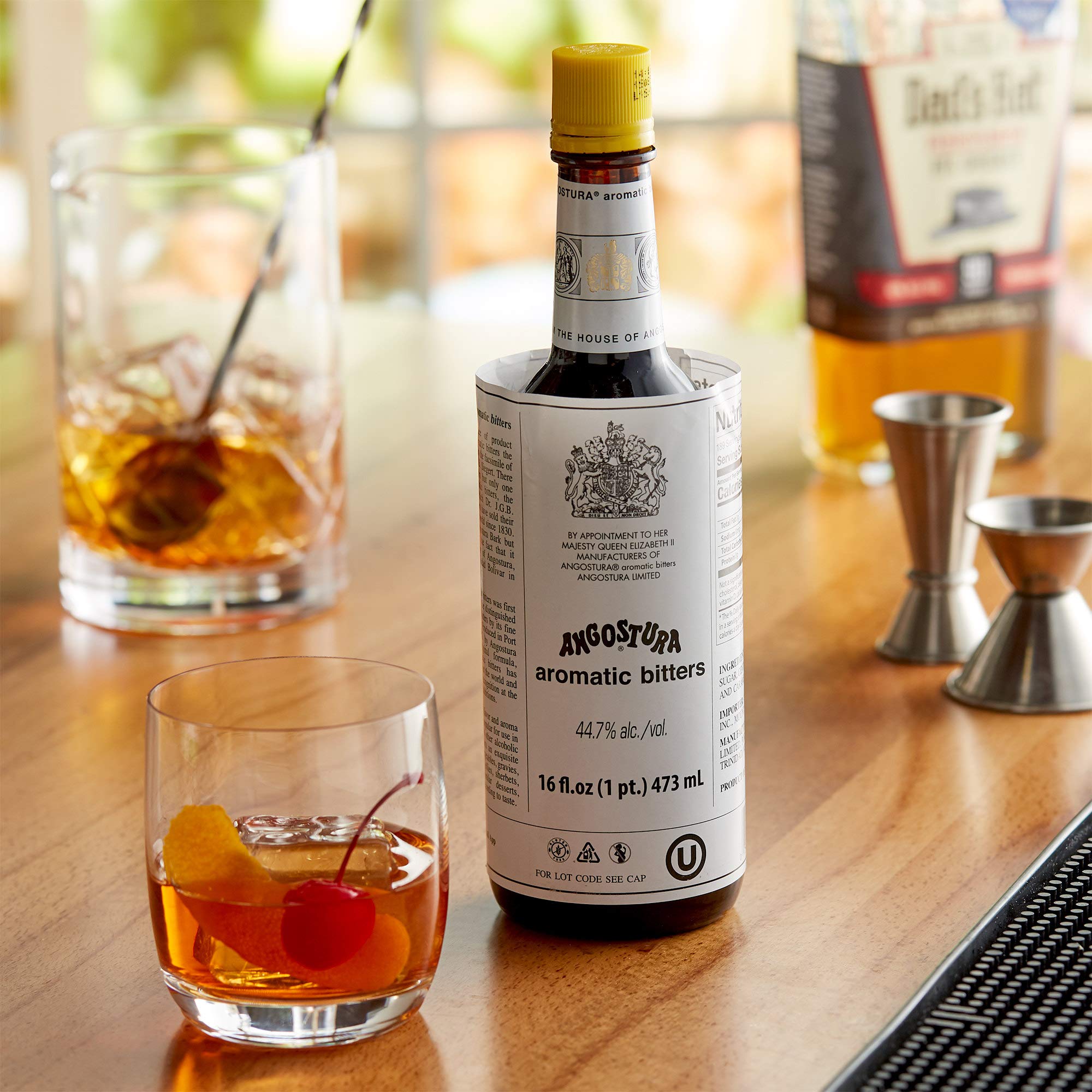 Pouring Angostura Aromatic Bitters to flavor a cocktail