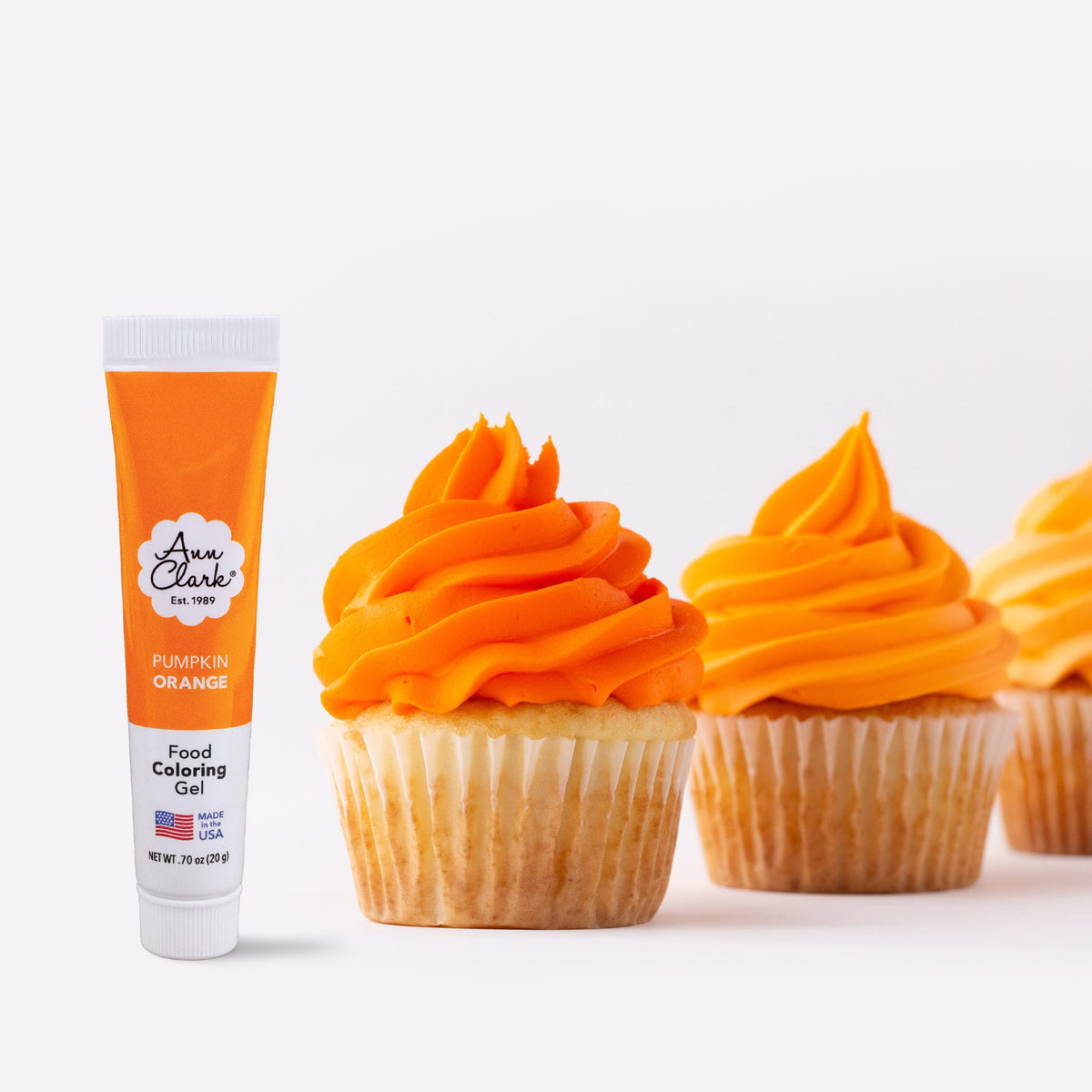 Ann Clark pumpkin orange gel color bottle close-up for vibrant icing.