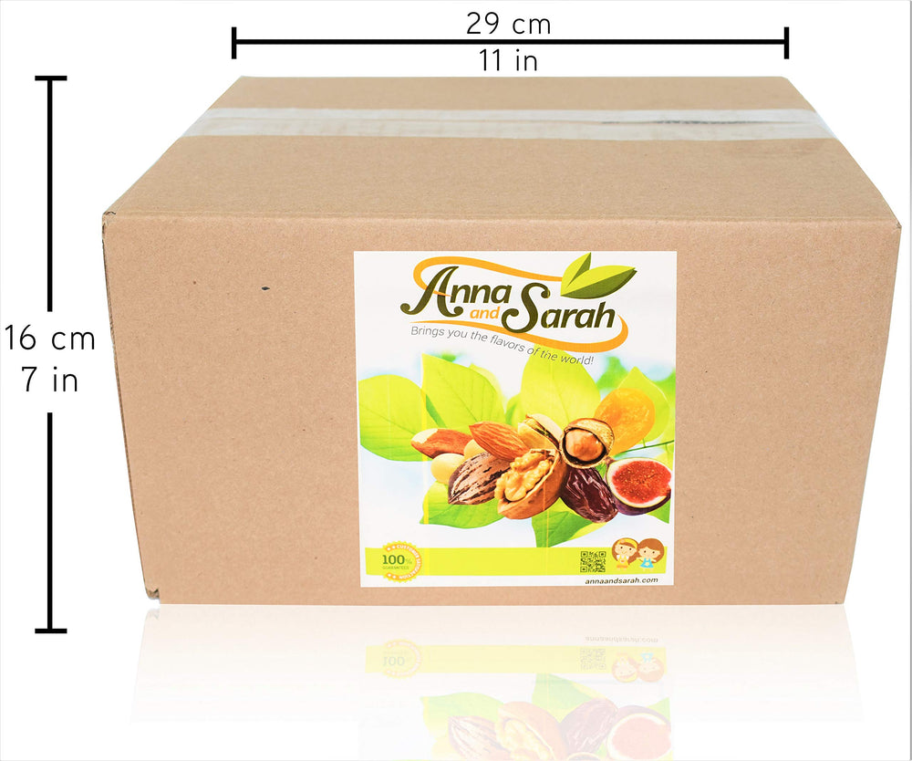 Anna and Sarah buttery Brazil nuts in a box ready to enjoy
