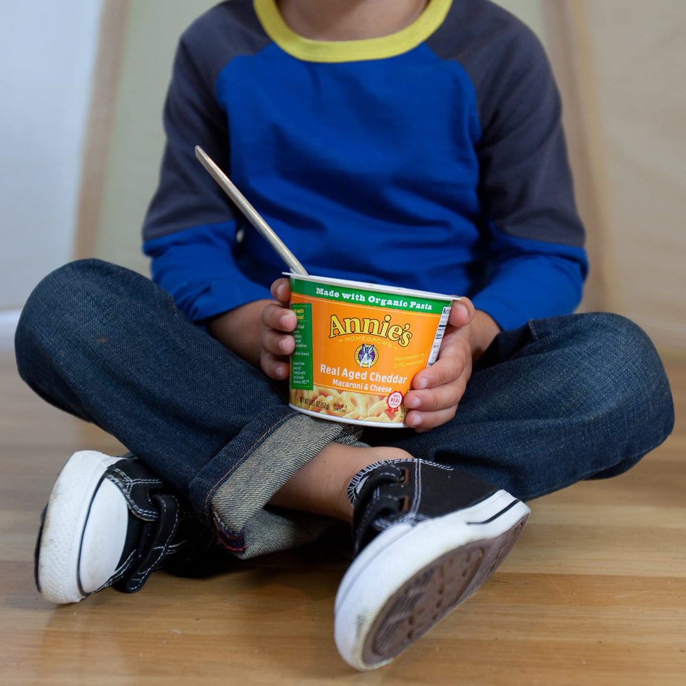 Annie's aged cheddar cheese close-up showing rich flavor.