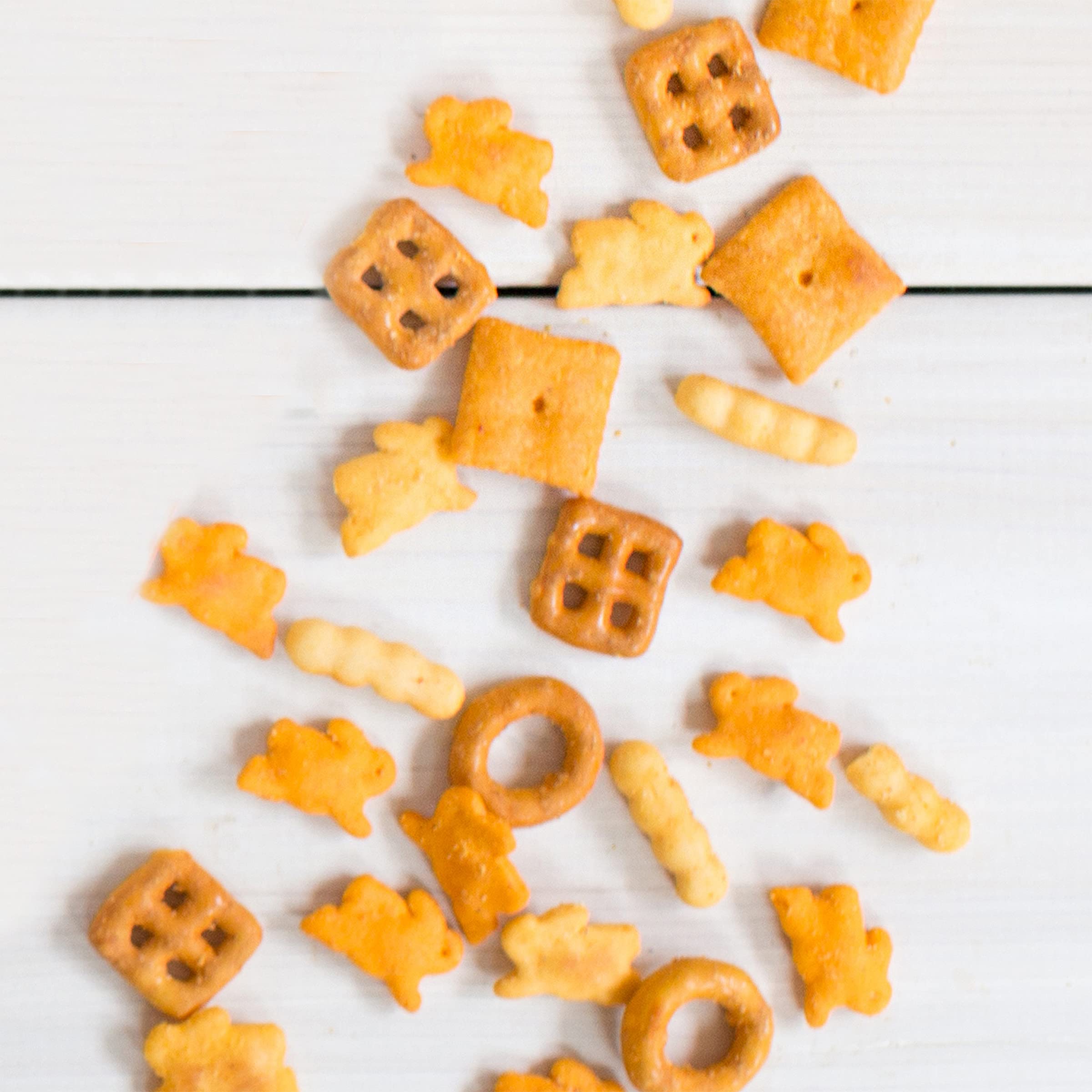 Annie's Cheddar Snack Mix pretzels and crackers closeup with cheddar seasoning highlight