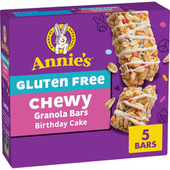 Annie's Gluten Free Chewy Granola Bars Birthday Cake packaging on a counter, ideal for lunchboxes.