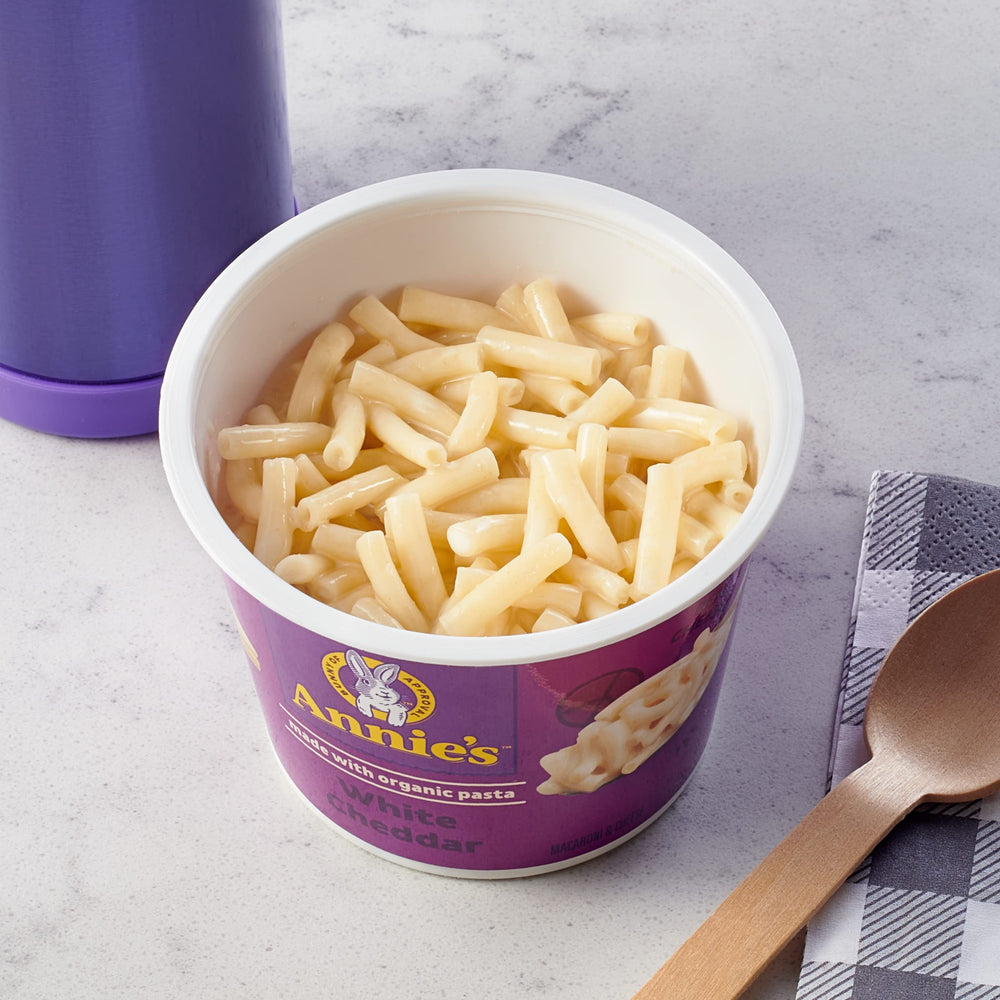 Close-up of Annie's microwavable Mac and Cheese cup with creamy cheese.