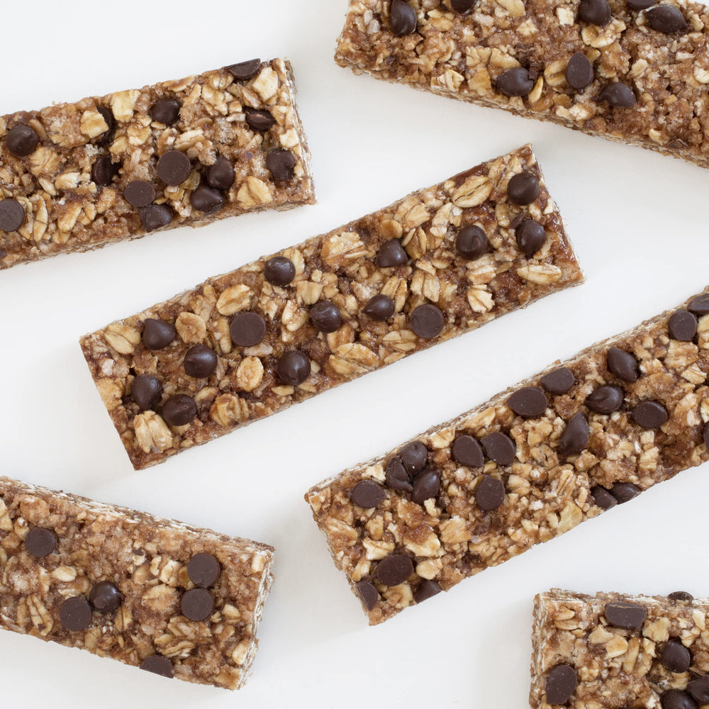 Annie's Organic Chewy Granola Bars on the go with a backpack, quick snack.