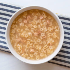 Annie’s Organic Star Pasta Chicken Soup chicken chunks close-up, protein-rich and satisfying.